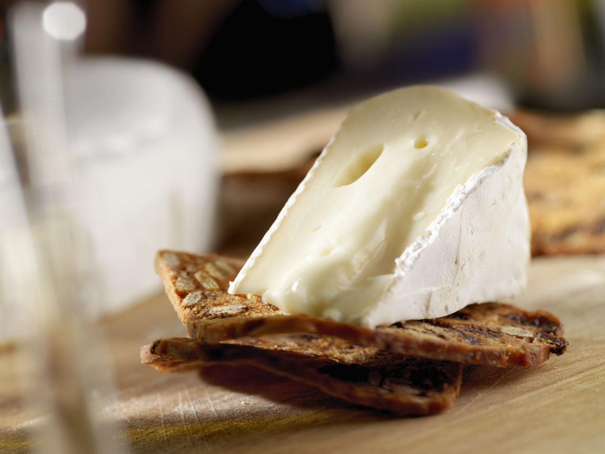 A Wedge of Brie Cheese on Crackers with Wine -Photographed on Hasselblad H3D2-39mb Camera